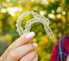 Invisalign patient showing aligners in Midlothian