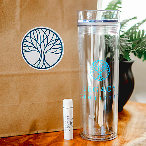 Lip balm and water bottle with dental office logo