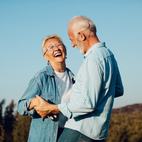 smiling mature couple with All-on-4 in Midlothian 