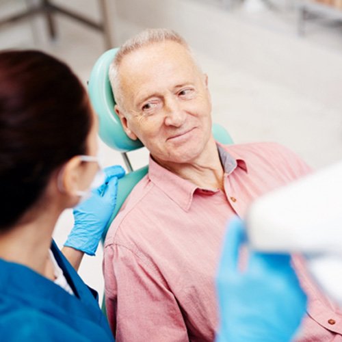 Senior man at consultation with dentist  