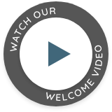 Play button that says watch our welcome video