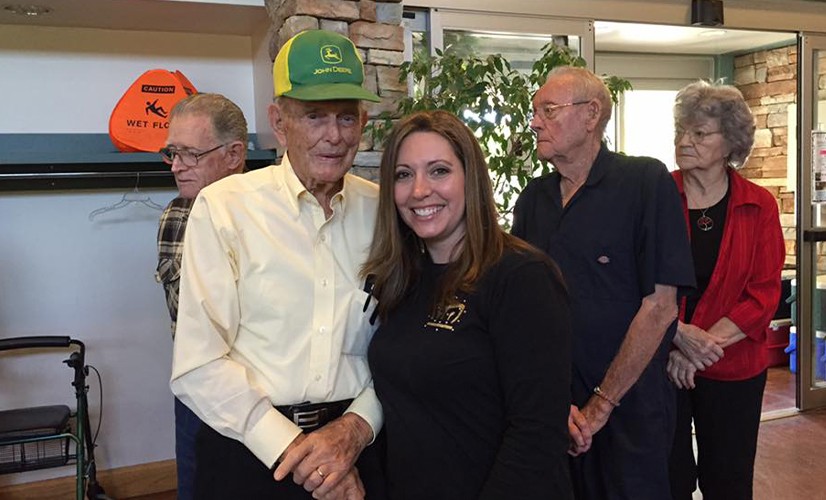 Group of patients smiling together at legacy dentistry grand opening