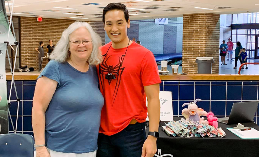 Dr. Nguyen and dental patient smiling together