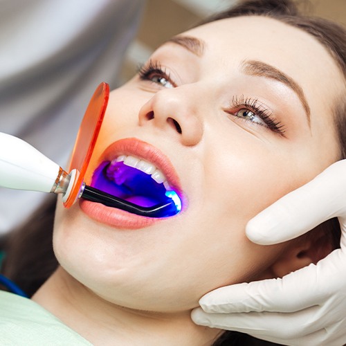 Woman receiving dental bonding treatment