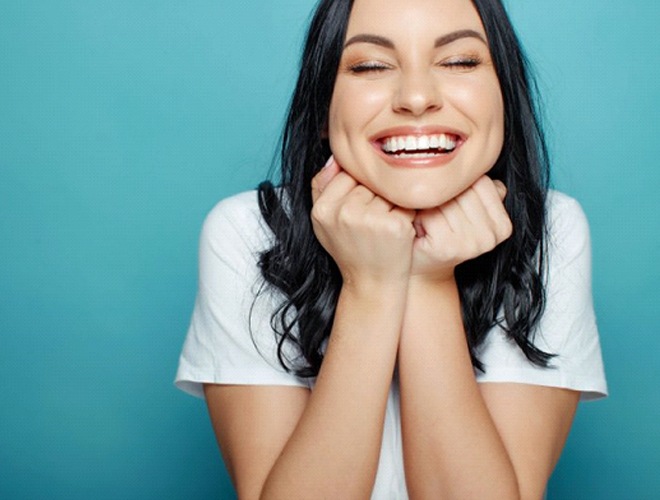 woman smiling after getting dental bonding in Midlothian