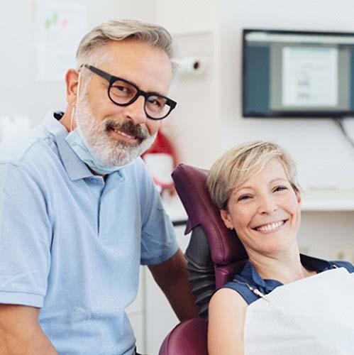 Emergency dentist in Midlothian smiling with a patient