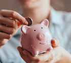 a person saving money in a piggy bank