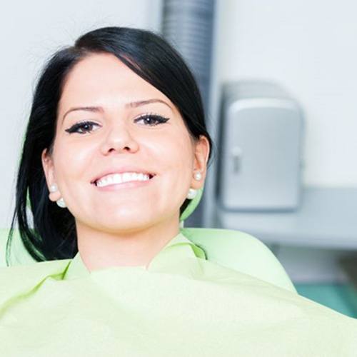 Close-up view of IV dSmiling, relaxed dental patient in treatment chairrip