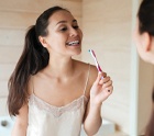 Woman brushing her teeth