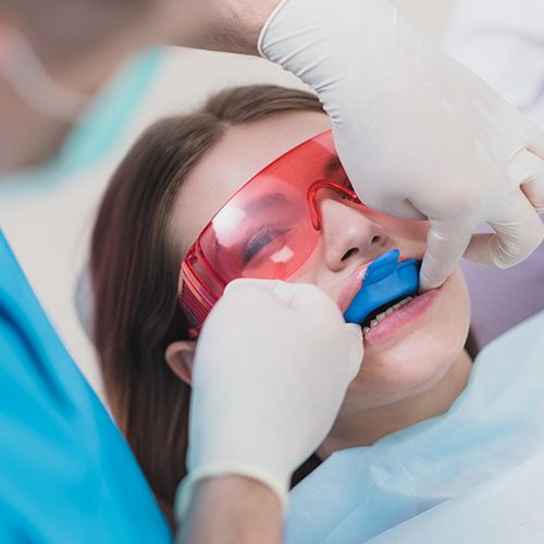 Patient receiving fluoride treatment