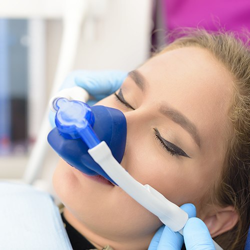 Woman with nitrous oxide sedation mask