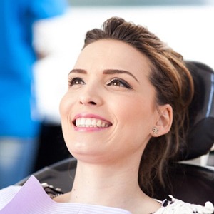 young woman smiling in the dental chair