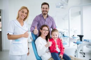 Smiling family visiting Midlothian family dentist