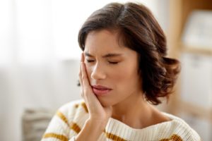 Woman experiencing a toothache.