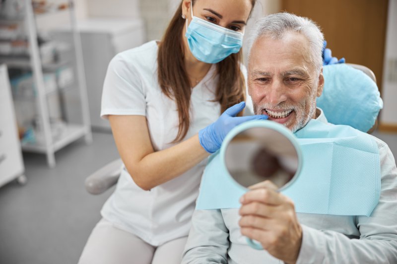An elderly patient getting dental implants