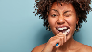 Someone brushing their teeth