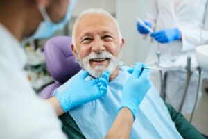 Senior man in dentist's chair.